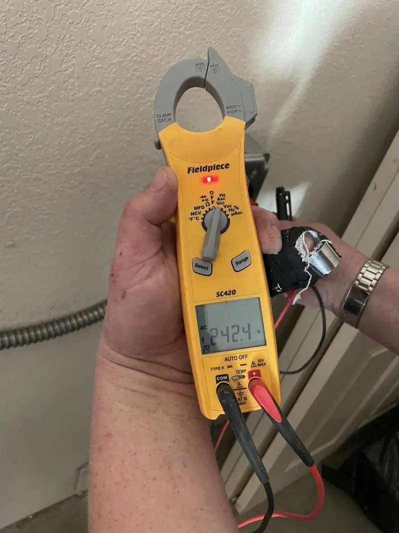 Voltage testing with clamp meter during Recessed Lighting Installation in Stanford